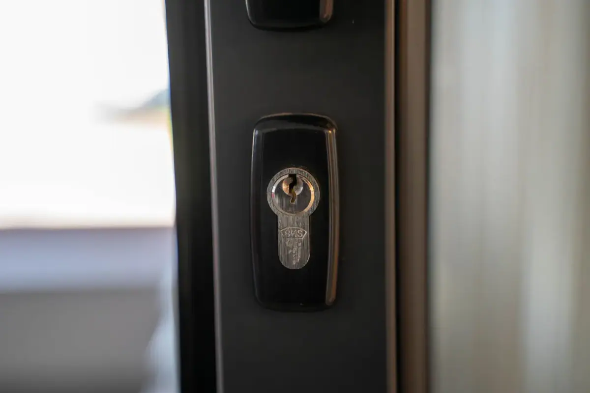 Key turning in a door lock, close up